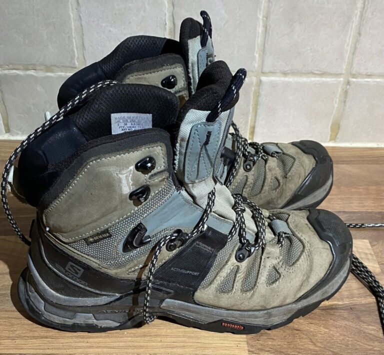 a pair of used hiking boots from salomon ready for recycling