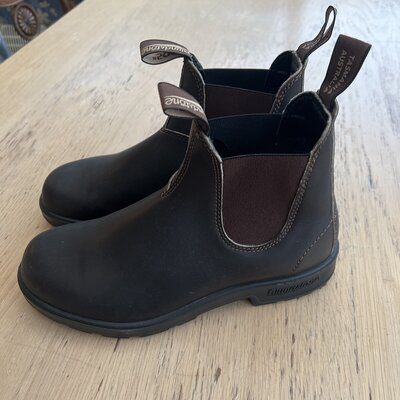 a pair of black Blundstone boots