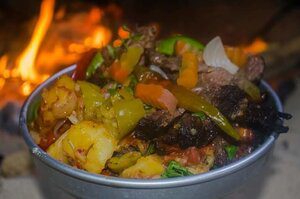 cooked vegetable with fire in the background
