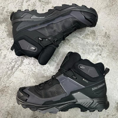 9 Best Hiking Boots for Beginners (2026 Reviewed & Ranked) Salomon X Ultra 5 Mid Gtx. A pair being displayed on the floor