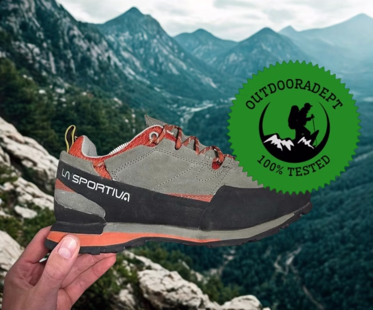 La Sportiva Boulder X held against a mountain valley view