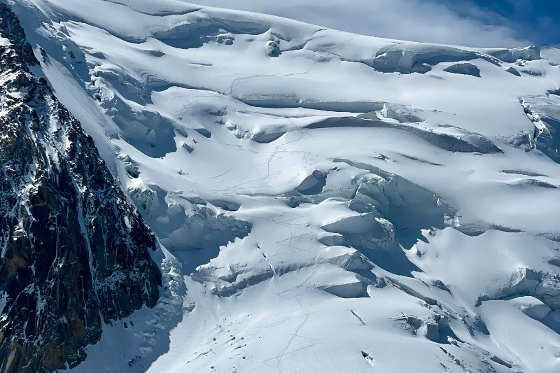 Mountaineering Beginners Guide: Preparing Your First Ascent an avalanche-prone mountain slope, showcasing challenging terrain.