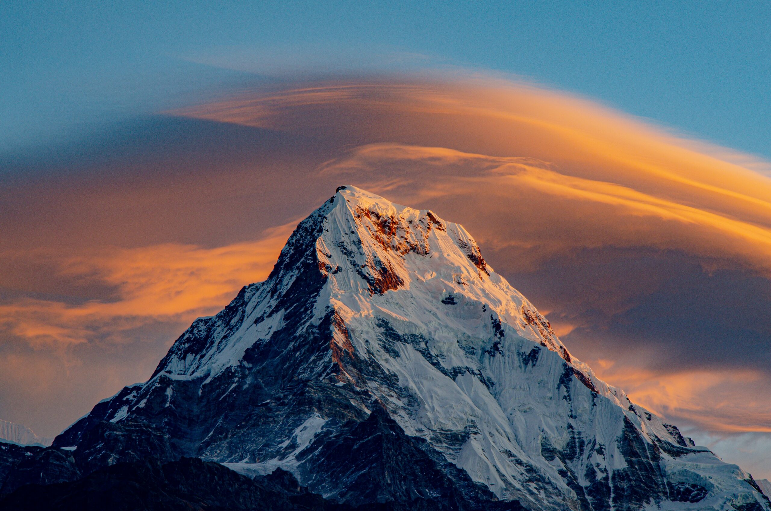 Alpinism vs. Mountaineering: Key Differences Explained The peak of Mt Everest at sunrise