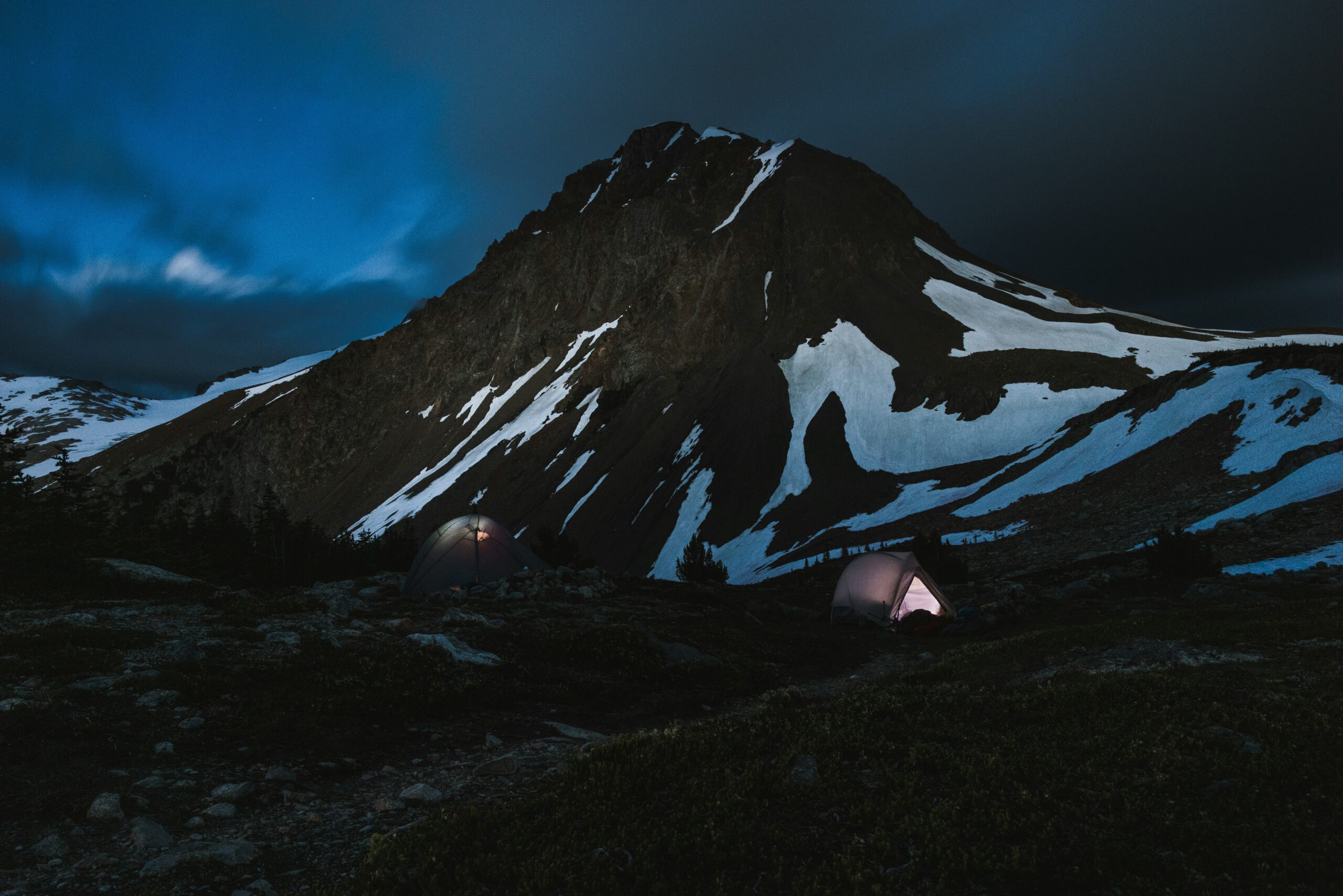 Alpinism vs. Mountaineering: Key Differences Explained mountaineering camp after sunset