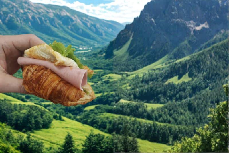 Camping For Beginners: 8 Tips For First Time Camping Trips Eating a croissant with a view (POV)