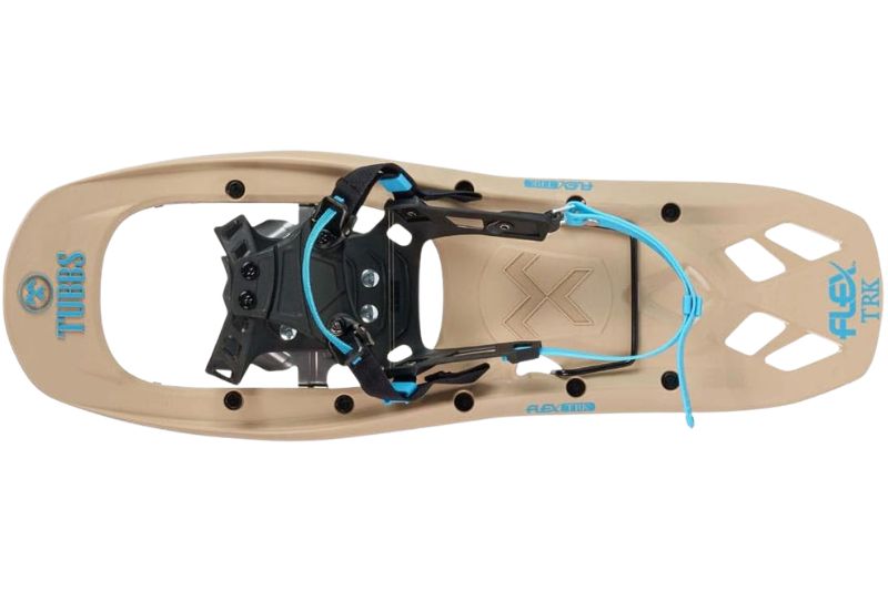 7 Best Snowshoes For Winter Hiking & Mountaineering Tan snowshoe with black and blue binding, designed for snowy terrains. The Tubbs logo and "Flex TRK" are visible, conveying a rugged, sporty feel.