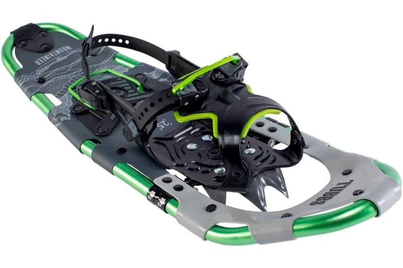 7 Best Snowshoes For Winter Hiking & Mountaineering A green and gray snowshoe with a sturdy aluminum frame and adjustable black bindings. It features a textured deck for grip, conveying durability and functionality.