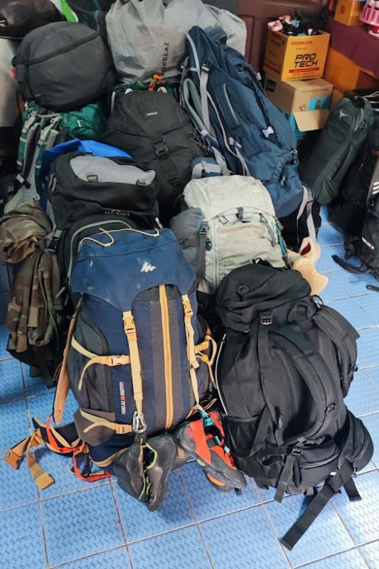 How to Turn Wild Camping Into a Glamping Experience A bunch of large backpacks piled together