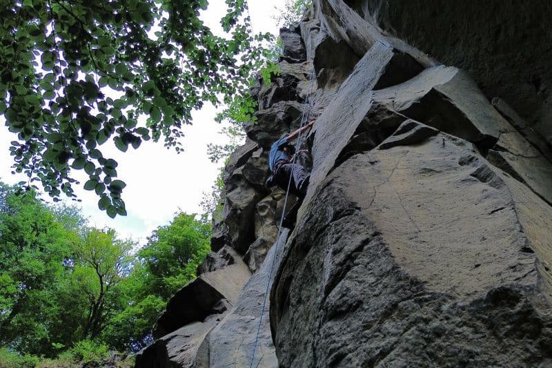 Essential Rope Skills & Knots for Mountaineering Melvin rock climbing and is being belayed via a toprope