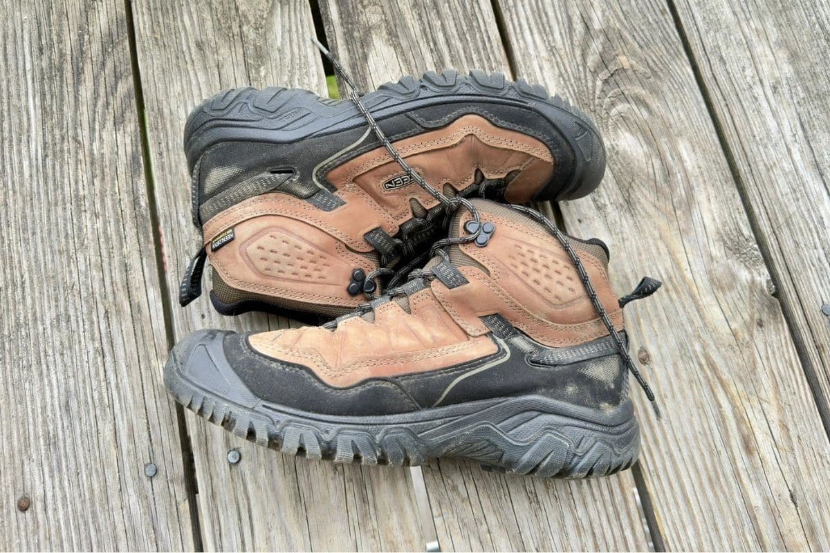 KEEN Targhee IV Mid Review | No More Sole Separation? A pair of KEEN Targhee IV Mid that are laying on a wooden surface with the top sides facing each other