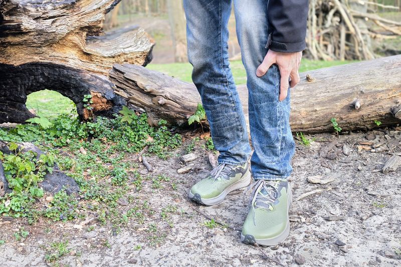 Hiking With Shin Splints: Expert Treatment Guide Person painfully grabbing his left leg