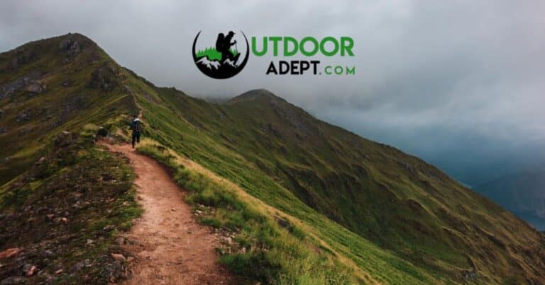 2026 Ultralight Gear Trends: The End of "Stupid Light"? Hiker with backpack on mountain ridge trail