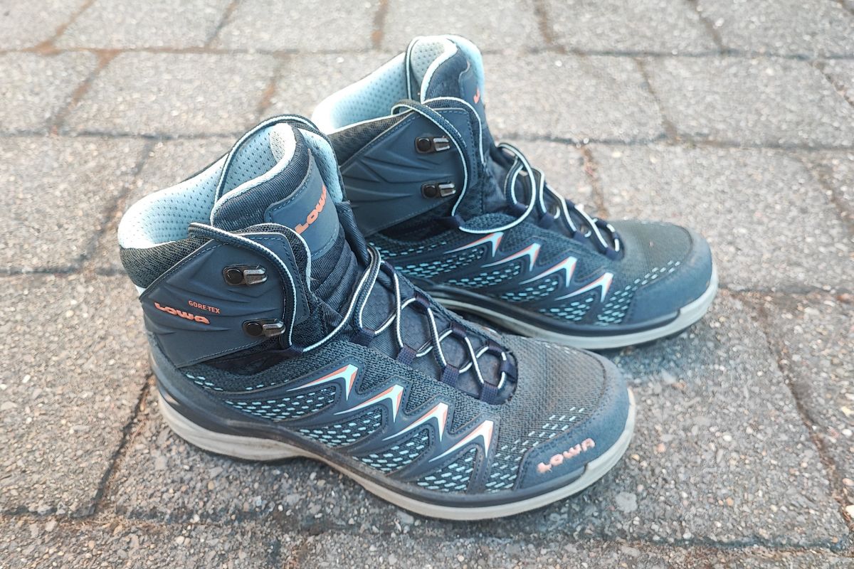 Lowa Innox Pro GTX Mid Review (2026 Test Results) A pair of Lowa Innox Pro Mid GTX seen from the side