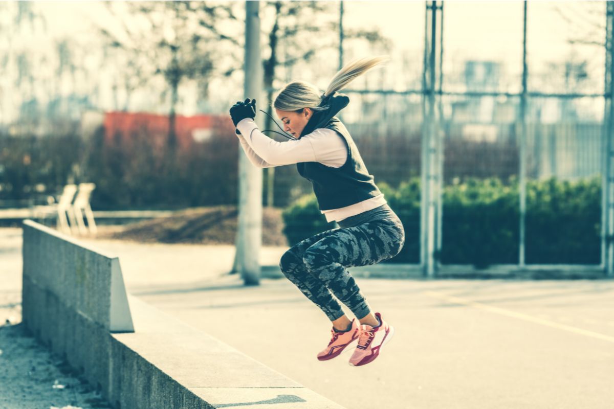 Athlete performing a squat jump to develop ankle power and landing control