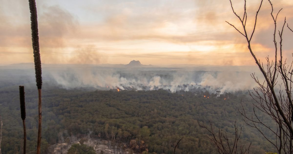 Hiking in Wildfire Smoke: AccuWeather Explains Wildfire as seen from a hill.