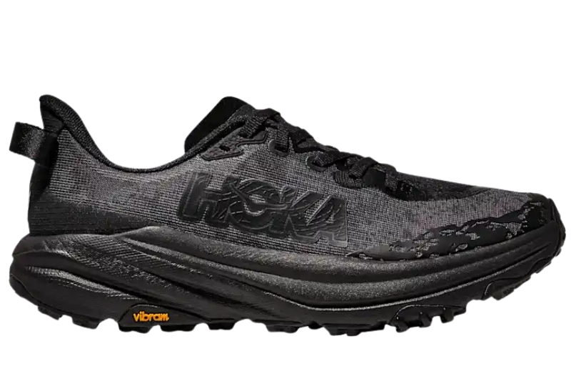 HOKA Speedgoat 6 trail running shoe in all black with a Vibram Megagrip outsole, side view