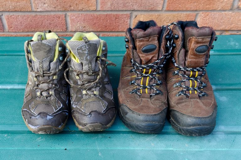 How to Choose Hiking Boots: A Field Tester's Guide (2026) Two pairs of worn hiking boots showing different designs