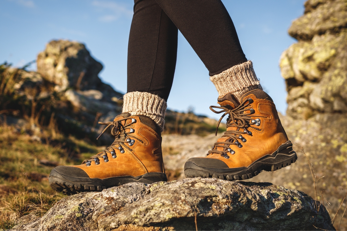 How to Choose Hiking Boots: A Field Tester's Guide (2026) How to choose hiking boots for women - a pair of women's brown hiking boots