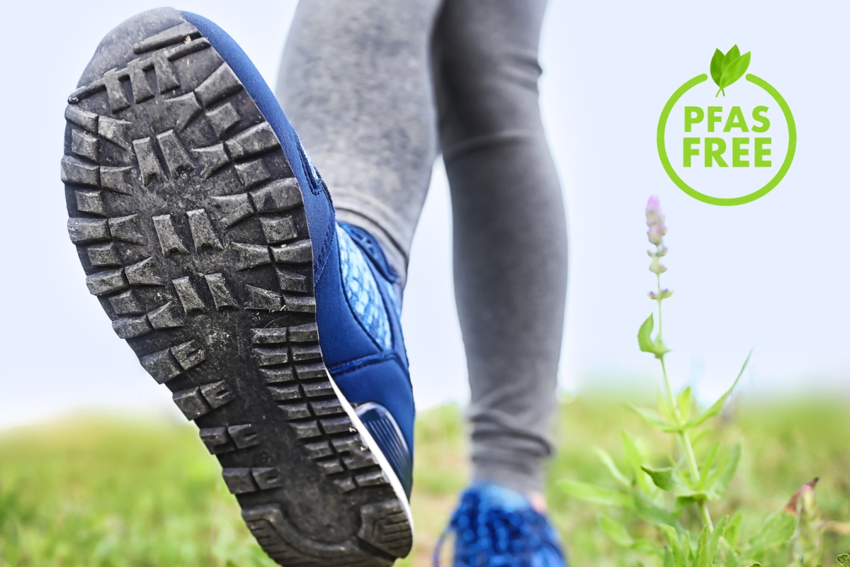 How to Choose Hiking Boots: A Field Tester's Guide (2026) Blue hiking shoe with a PFAS-free label and visible lugged sole