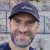 Sergio López Prieto, guest author on OutdoorAdept, smiling in a dark cap on Montserrat.