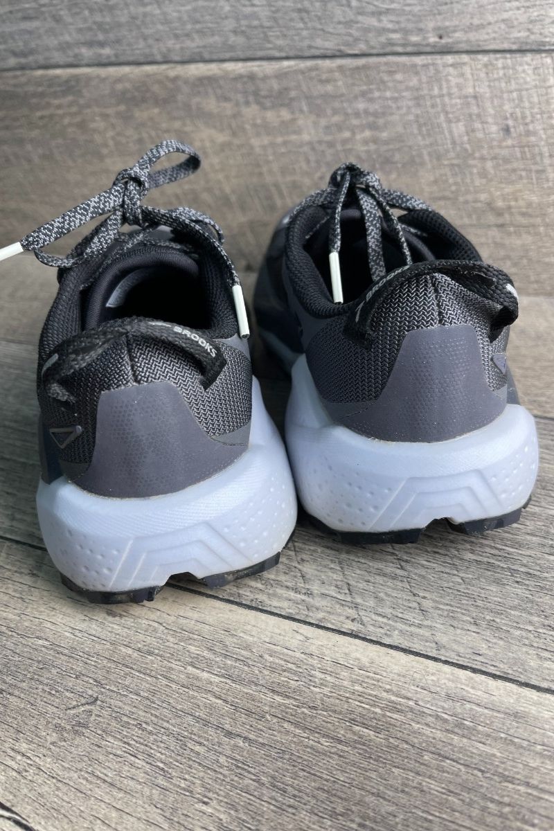 Rear view of the Brooks Caldera 8 with fabric heel pull loops and a wide, flared midsole
