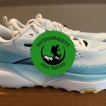 Side profile of the women's Brooks Cascadia 20 trail running shoe with the OutdoorAdept 100% Tested badge