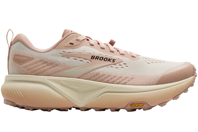 Brooks Cascadia 20 trail running shoe in a pink and cream colorway, side view with Vibram outsole
