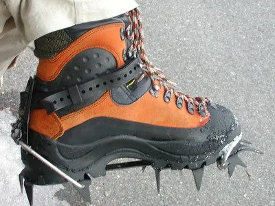 hiking claws mounted on hiking boots