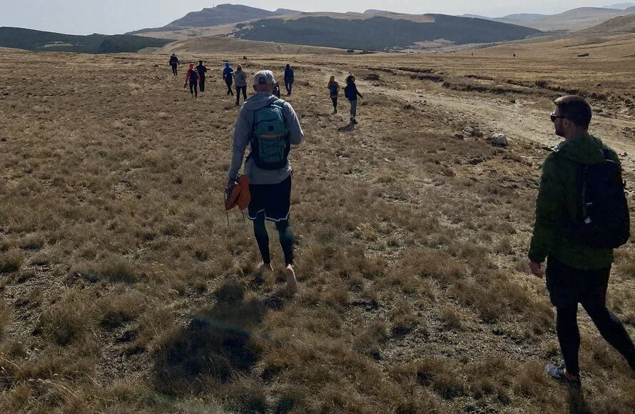 Knee Pain When Hiking Downhill? (What You Have to Do) group of people hiking downhill